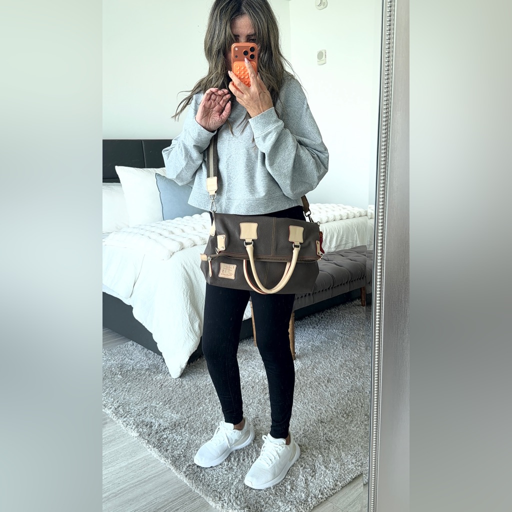 Grey Leather Crossbody Bag With Cream Handles And Red Piping Across The Lining